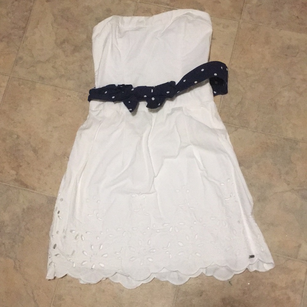 Strapless eyelet dress. Stretch back.